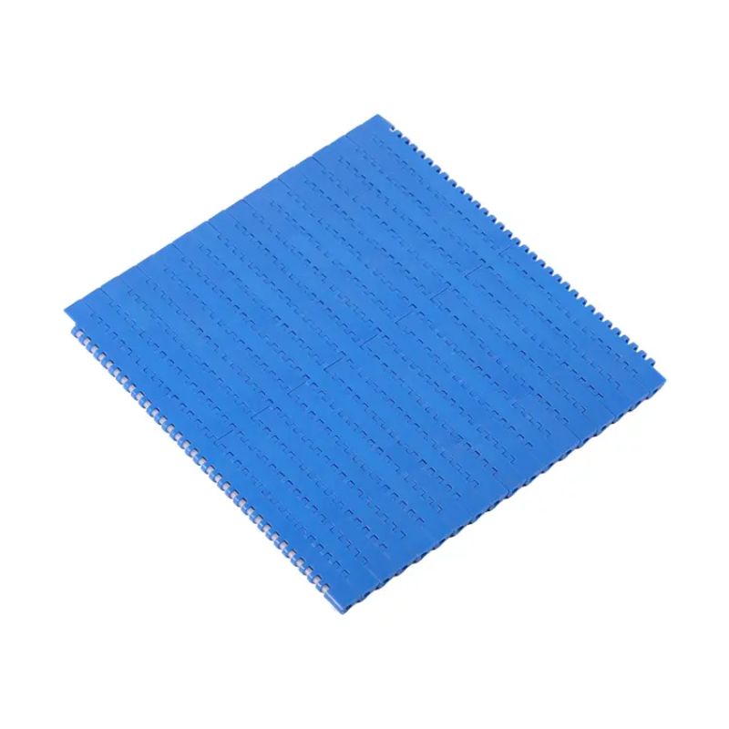 Flat top modular belt surface for stable transfers and packaging flow