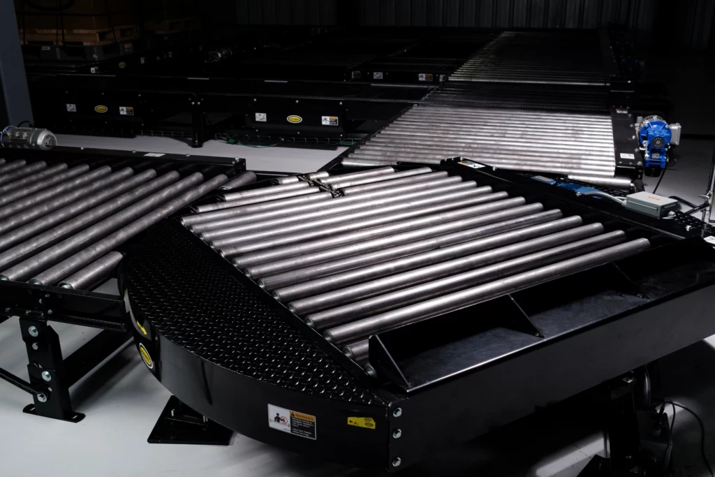 Turntables for conveyor direction changes and compact routing